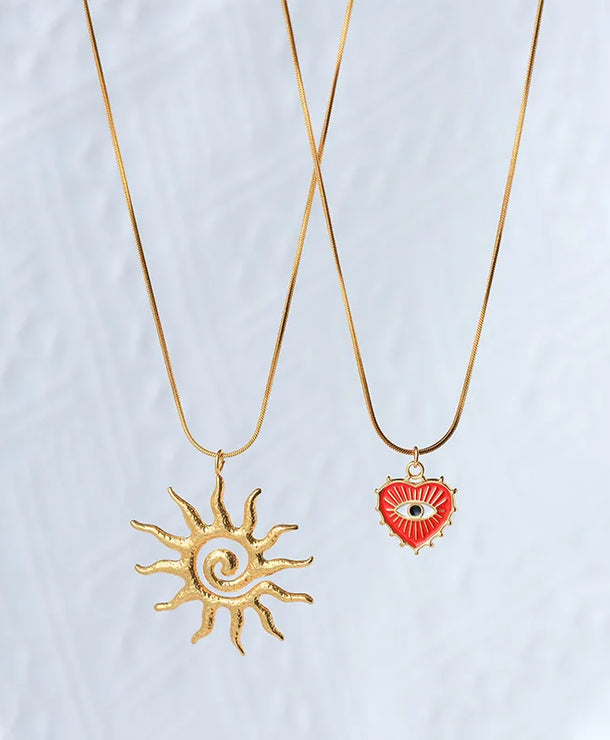 Collar con dije de sol, ojo turco y corazón en acero inoxidable 304