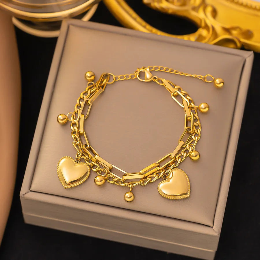 Pulsera de corazones con cadena cubana en acero 304 y baño de oro 18K - imagen 36