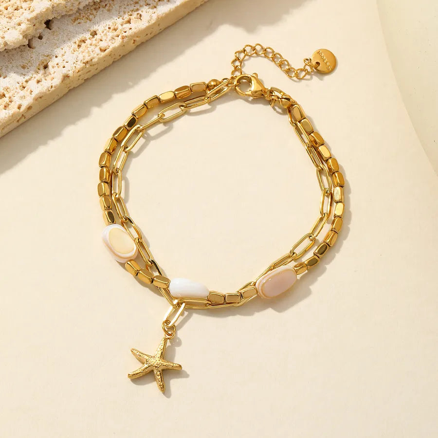 Pulsera de acero 304 con dijes de estrella de mar, corazón y concha - imagen 11