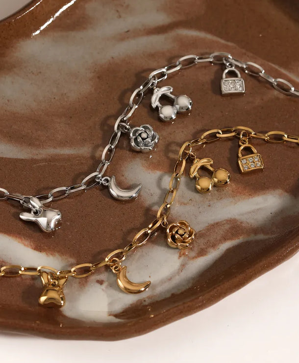 Pulsera de flores de cereza con baño de oro y circonias en acero 304 - imagen 3