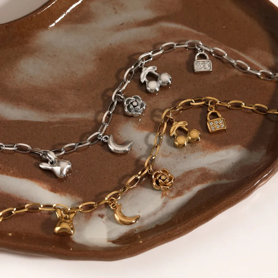 Pulsera de flores de cereza con baño de oro y circonias en acero 304 - imagen 3
