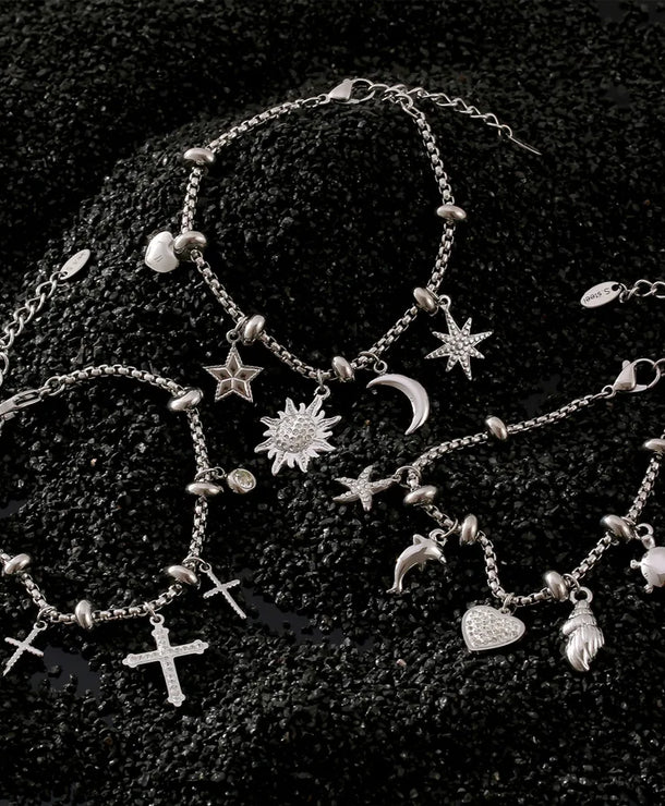 Pulsera de acero 304 con baño de oro 18K y dijes de cruz, estrella y corazón - imagen 5