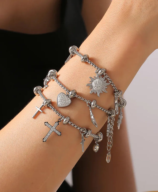 Pulsera de acero 304 con baño de oro 18K y dijes de cruz, estrella y corazón - imagen 6