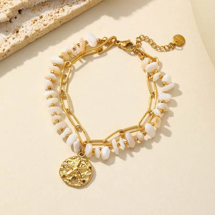 Pulsera de acero 304 con dijes de estrella de mar, corazón y concha - imagen 3