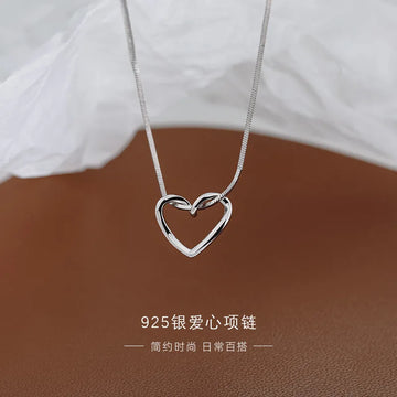 Corazón calado oro blanco