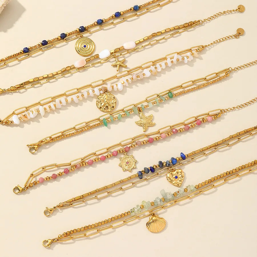 Pulsera de acero 304 con dijes de estrella de mar, corazón y concha - imagen 2