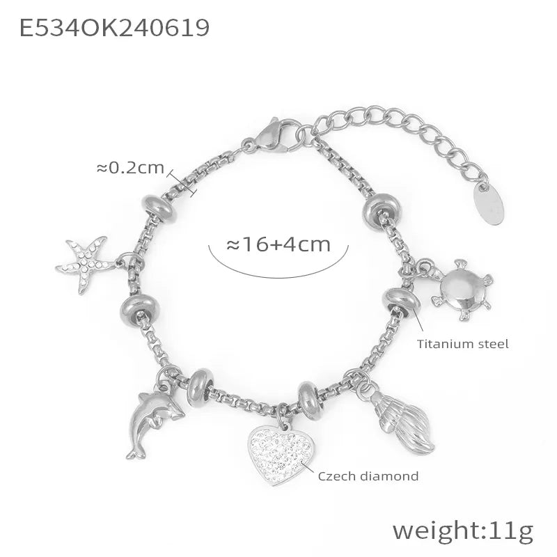Pulsera de acero 304 con baño de oro 18K y dijes de cruz, estrella y corazón - imagen 12
