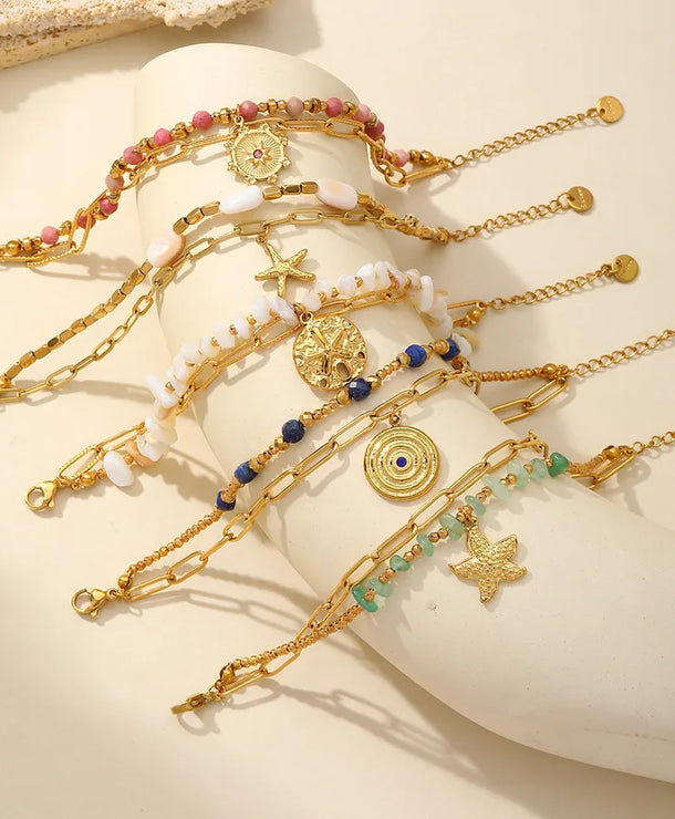 Pulsera de acero 304 con dijes de estrella de mar, corazón y concha