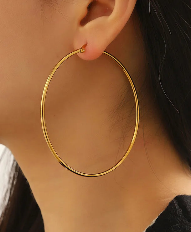 Aretes de acero con diseño de círculo y acabado pulido para mujer