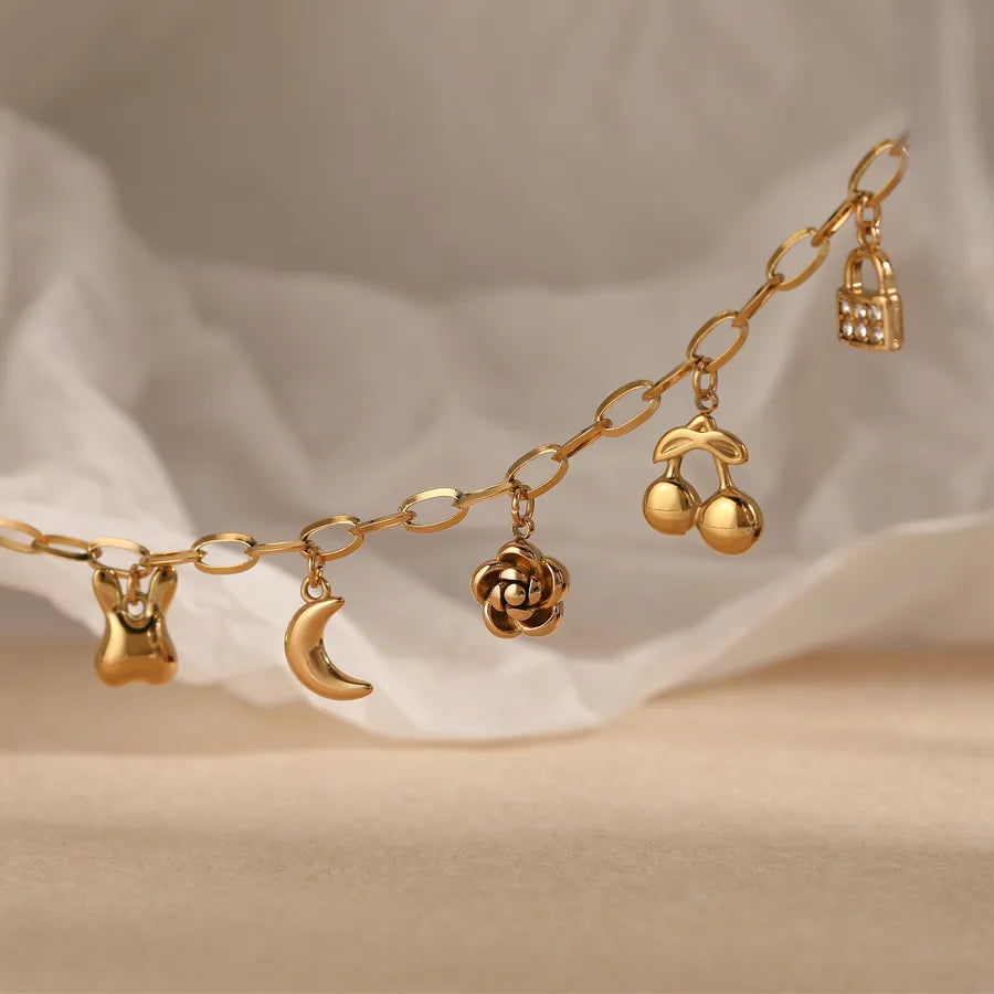 Pulsera de flores de cereza con baño de oro y circonias en acero 304 - imagen 4