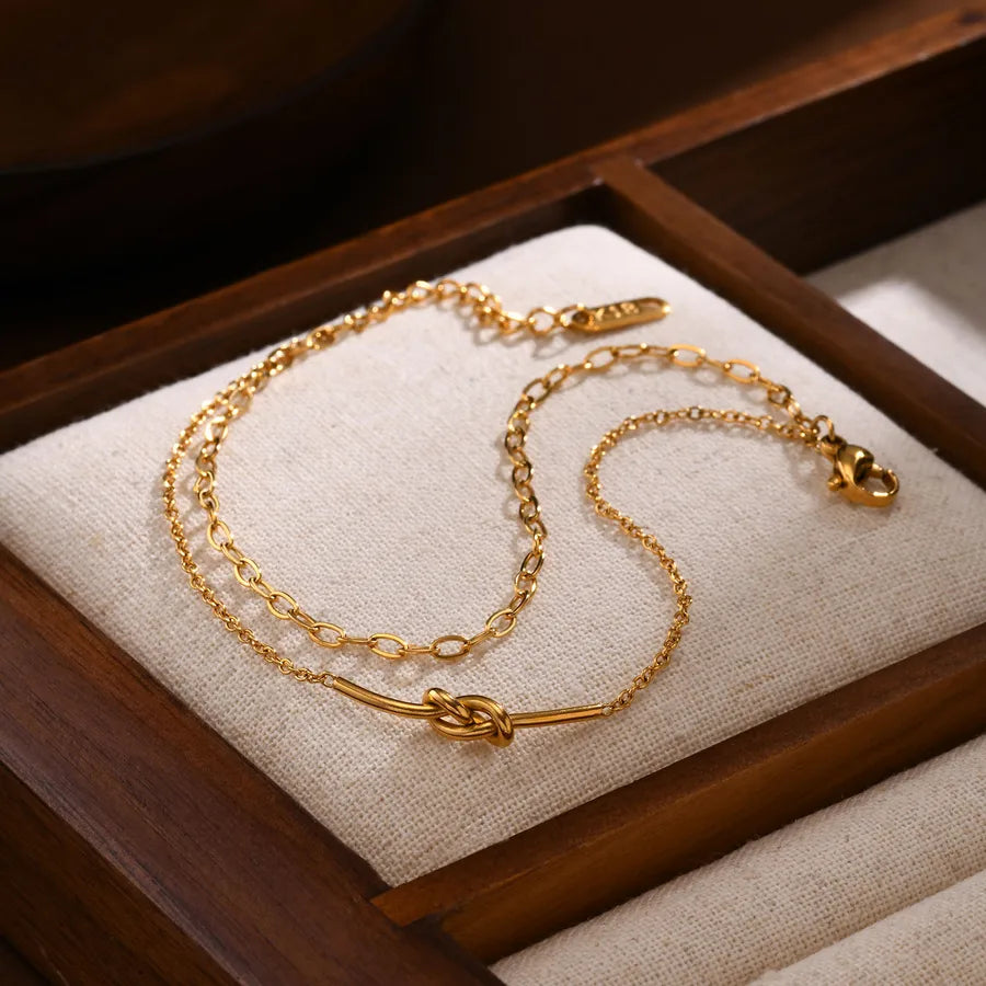Pulsera con diseño de nudo en acero 201 y baño de oro 18K - imagen 5